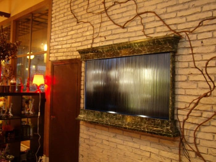 wall mounted indoor fountain with gold marble design e1522084192801 glass-fountain